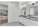 Bathroom features a double vanity with stone countertops and a walk-in closet with custom shelving at 3537 Crosstrees Ln, Mount Pleasant, SC 29466