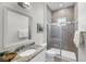 Well-lit bathroom featuring granite countertops, a walk-in shower, and neutral tiling at 3537 Crosstrees Ln, Mount Pleasant, SC 29466