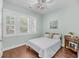 Comfortable bedroom with natural light from shuttered windows, hardwood floors and cozy décor at 3537 Crosstrees Ln, Mount Pleasant, SC 29466