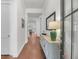 Inviting entryway with hardwood floors, a stylish console table, and a view into the spacious living area at 3537 Crosstrees Ln, Mount Pleasant, SC 29466