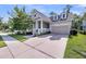 Attractive home with a two-car garage, a cozy front porch, and well-manicured landscaping at 3537 Crosstrees Ln, Mount Pleasant, SC 29466