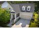 Charming home featuring a welcoming front porch, attached two car garage, and beautifully landscaped yard at 3537 Crosstrees Ln, Mount Pleasant, SC 29466