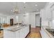 Spacious kitchen with marble countertops, stainless steel appliances, and an open layout to the adjacent dining area at 3537 Crosstrees Ln, Mount Pleasant, SC 29466