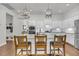 Modern kitchen with white cabinets, a marble island, stainless steel appliances, and stylish pendant lighting at 3537 Crosstrees Ln, Mount Pleasant, SC 29466