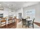 Elegant kitchen featuring white cabinets, marble countertops, stainless steel appliances, and a dining area with natural light at 3537 Crosstrees Ln, Mount Pleasant, SC 29466