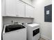 Clean, white laundry room featuring modern washer and dryer with white cabinets above at 3537 Crosstrees Ln, Mount Pleasant, SC 29466