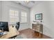 Bright office with hardwood floors, a ceiling fan, and a large desk facing the window at 3537 Crosstrees Ln, Mount Pleasant, SC 29466
