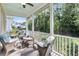 Comfortable screened-in porch with patio furniture and a view of the backyard and trees at 3537 Crosstrees Ln, Mount Pleasant, SC 29466