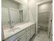 Bathroom with white cabinets, marble floors and a large mirror at 444 Parish Farms Dr, Summerville, SC 29486
