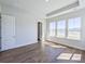 Beautiful bedroom with wood floors, large windows overlooking pond, and recessed lighting at 444 Parish Farms Dr, Summerville, SC 29486