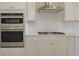 Kitchen featuring stainless steel appliances, white cabinets, and a subway tile backsplash at 444 Parish Farms Dr, Summerville, SC 29486