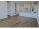 Living room and kitchen area with an open floor plan and lots of natural light at 444 Parish Farms Dr, Summerville, SC 29486