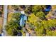 Bird's eye view of a tree-covered property featuring a single-story home with a metal roof at 4715 Highway 165, Meggett, SC 29449
