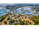 Expansive aerial view of a marshy landscape with waterways and roadways nearby surrounding an impressive property at 4715 Highway 165, Meggett, SC 29449