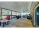 Spacious covered back deck with comfortable seating and views of the yard perfect for entertaining at 4715 Highway 165, Meggett, SC 29449