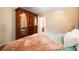 Comfortable bedroom with mirrored armoire, natural light, and soft green carpet at 4715 Highway 165, Meggett, SC 29449