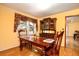 Traditional dining room with a wooden table and cabinet at 4715 Highway 165, Meggett, SC 29449