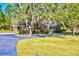 Well-maintained brick house featuring a spacious yard and a covered porch at 4715 Highway 165, Meggett, SC 29449