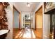 Inviting hallway with hardwood floors and natural light at 4715 Highway 165, Meggett, SC 29449