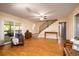 Open-concept living room with hardwood floors and staircase leading to the upper level at 4715 Highway 165, Meggett, SC 29449