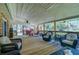 Spacious outdoor porch area, perfect for relaxation and outdoor enjoyment with comfortable seating and ceiling fan at 4715 Highway 165, Meggett, SC 29449