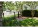 Lush backyard featuring manicured lawn with an ornamental fence, greenery, and shade from a mature tree at 5008 Northfield Ct, Charleston, SC 29414