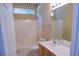 The bright bathroom includes a tub, shower, white fixtures, and single sink at 5008 Northfield Ct, Charleston, SC 29414