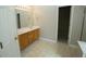 Well-lit bathroom featuring a double sink vanity and tile flooring at 5008 Northfield Ct, Charleston, SC 29414