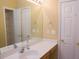 Bathroom vanity with ample counter space and storage, next to multiple doors at 5008 Northfield Ct, Charleston, SC 29414