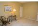 Neutral bedroom with window art, soft curtains, comfortable chair, and neutral carpet at 5008 Northfield Ct, Charleston, SC 29414