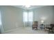 Bright bedroom with lots of natural light from the windows, ceiling fan, and rocking chair at 5008 Northfield Ct, Charleston, SC 29414