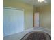 A bedroom with neutral walls, ceiling fan, and large closet offers ample space at 5008 Northfield Ct, Charleston, SC 29414