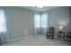 Bright bedroom with lots of natural light from the windows, ceiling fan, and rocking chair at 5008 Northfield Ct, Charleston, SC 29414