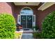 Charming front porch with elegant double doors, seasonal decor, and manicured landscaping at 5008 Northfield Ct, Charleston, SC 29414