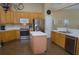 Charming kitchen featuring stainless appliances, wooden cabinets, and an island, perfect for cooking and entertaining at 5008 Northfield Ct, Charleston, SC 29414