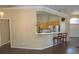 The kitchen has modern appliances and a bar area with chairs, perfect for casual dining and gathering at 5008 Northfield Ct, Charleston, SC 29414