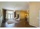 Expansive living room boasts natural light, hardwood floors, and comfortable seating at 5008 Northfield Ct, Charleston, SC 29414