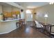 Bright, open living room flows to kitchen with breakfast bar seating and lots of natural light at 5008 Northfield Ct, Charleston, SC 29414
