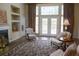 Bright living room with hardwood floors, fireplace, and patio doors, creating a warm and welcoming atmosphere at 5008 Northfield Ct, Charleston, SC 29414