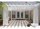 Charming patio featuring a white pergola, ceiling fan, and access to the home, perfect for outdoor living and relaxation at 5008 Northfield Ct, Charleston, SC 29414