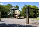 Community playground with a slide, play structure, and swings for outdoor fun at 5008 Northfield Ct, Charleston, SC 29414