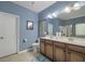 Bathroom with a double sink vanity, commode, and tiled shower with glass doors at 5011 W Liberty Meadows Dr, Summerville, SC 29485