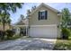 Charming two-story home with a well-maintained lawn and a welcoming porch, creating a warm and inviting curb appeal at 5011 W Liberty Meadows Dr, Summerville, SC 29485