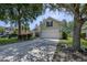 Charming two-story home with green lawn, wide driveway, and an attached two car garage at 5011 W Liberty Meadows Dr, Summerville, SC 29485