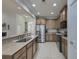 Modern kitchen with stainless steel appliances, granite counters, and neutral-toned cabinets at 5011 W Liberty Meadows Dr, Summerville, SC 29485