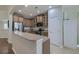 Well-lit kitchen with granite countertops, stainless steel appliances, and ample cabinet space for storage and food preparation at 5011 W Liberty Meadows Dr, Summerville, SC 29485