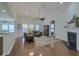 Spacious living room boasts a fireplace, abundant natural light, and hardwood floors at 5011 W Liberty Meadows Dr, Summerville, SC 29485