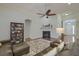 Cozy living room with a fireplace, comfortable seating, and a decorative rug, creating an inviting space for relaxation at 5011 W Liberty Meadows Dr, Summerville, SC 29485
