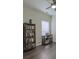 Office space featuring hardwood floors, a bookcase, and a desk with natural light at 5011 W Liberty Meadows Dr, Summerville, SC 29485