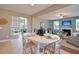 Open-concept living space with fireplace, dining area and view to living room at 507 Cropfield Dr, Summerville, SC 29485